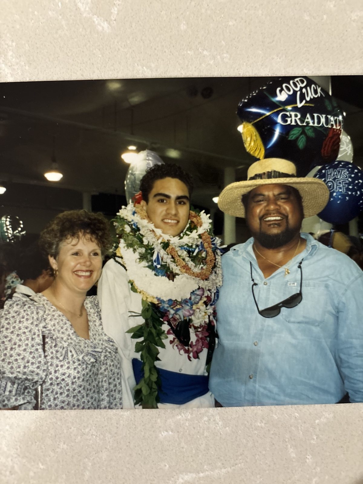 Keoni celebrating with a student at graduation