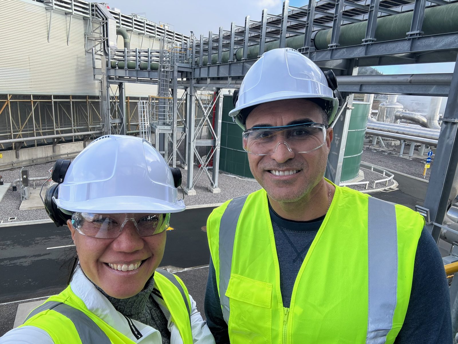 Keoni in a hard hat and safety vest on an infrastructure site visit