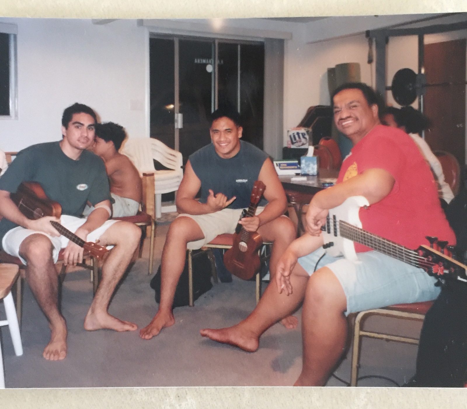Keoni playing music with family and friends